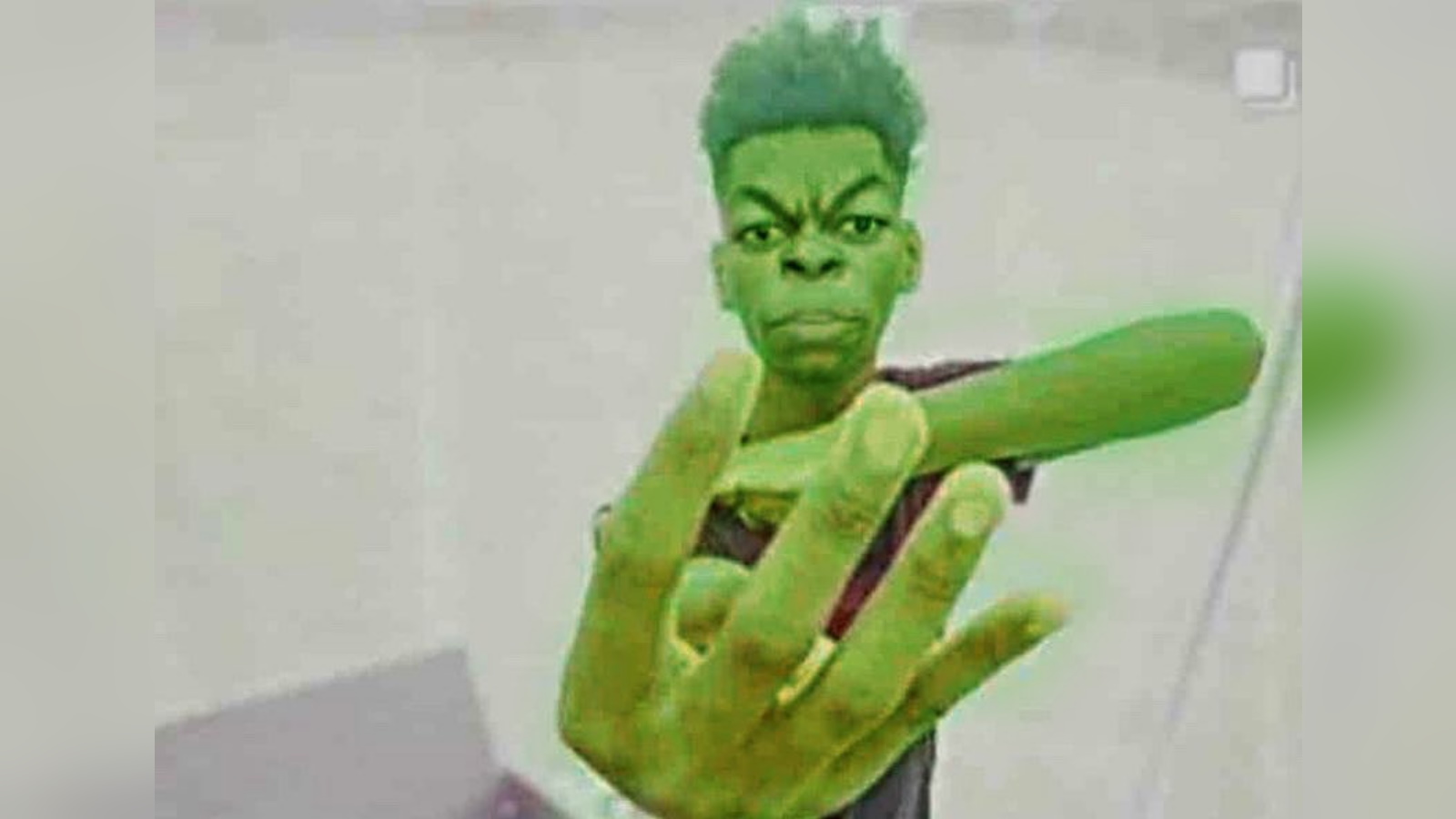 Beast Boy / Guy Holding Up Four Fingers