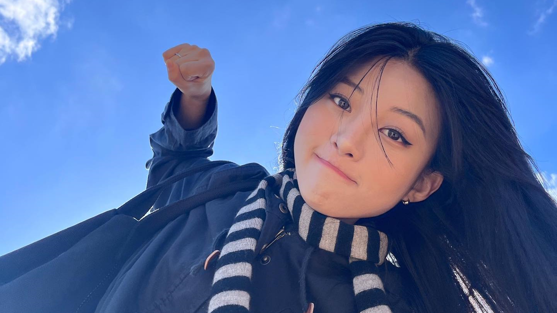 Korean Girl in a Gru Scarf Punching