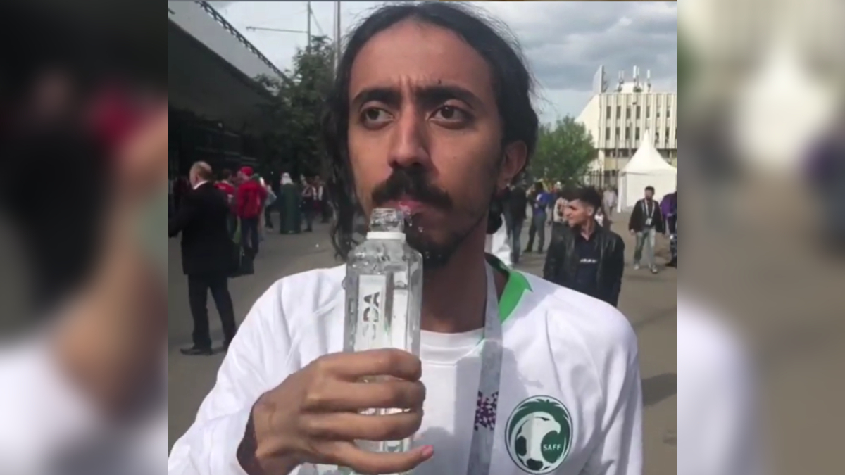 Man Shaking While Drinking Water