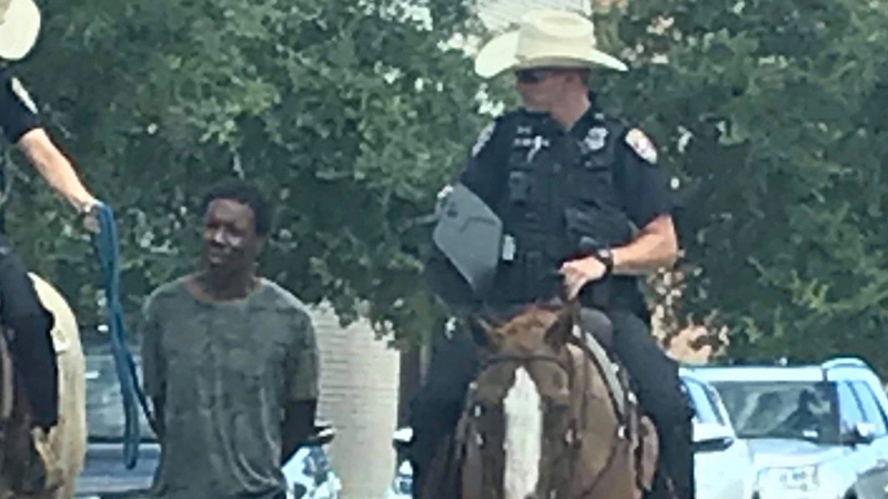 Mounted Police Officer Leading Black Man By a Rope Meme Template