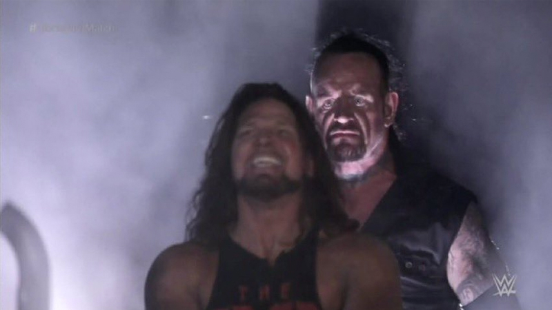 Undertaker Standing Behind AJ Styles